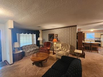 Norman house for rent - a living room filled with furniture and a table