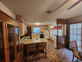 Norman house for rent - a kitchen and dining room with a table and chairs