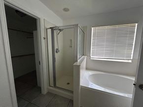 Killeen house for rent - a small bathroom with a tub and a shower