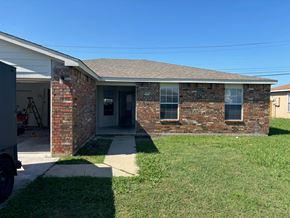 Killeen house for rent - a brick house with a lawn and a truck in front
