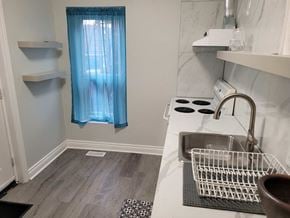Hamilton house for rent - a small kitchen with a sink and a window