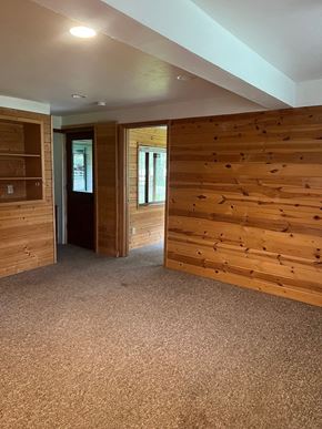 Whitefish apartment for rent - a living room with a wooden wall in a house