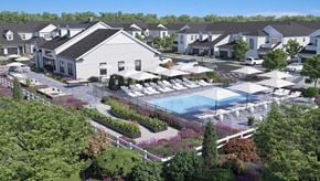 Commack apartment for rent - an aerial view of a pool and patio area at an apartment complex