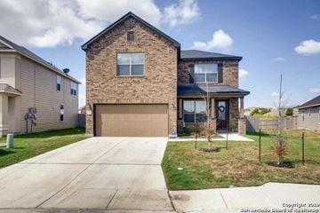 Converse house for rent - A two-story house with a garage is situated in a residential area.