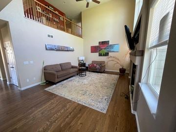 Castle Pines house for rent - a living room with a couch and a rug