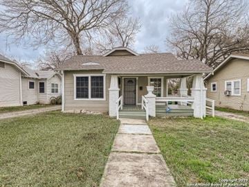 San Antonio house for rent - A house with a front porch and a white picket fence.