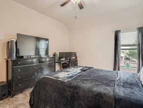 San Antonio house for rent - a bedroom with a bed and a tv in it
