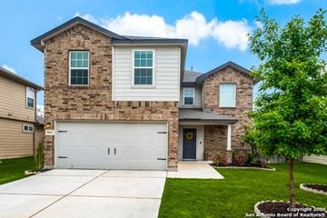 San Antonio house for rent - A two-story house with a garage and a driveway.