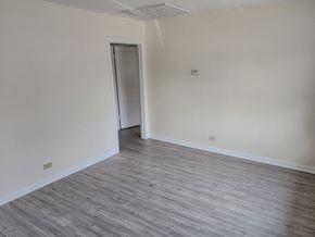 San Antonio house for rent - a empty room with wood flooring and white walls