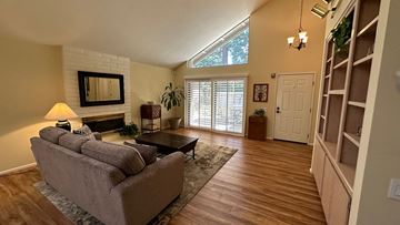 Gold River house for rent - a living room with a couch and a fireplace