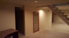 Ferguson house for rent - an empty room with a staircase and a door