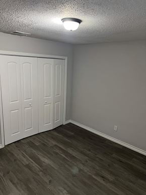 Lake Charles apartment for rent - a bedroom with two closets and a wood flooring