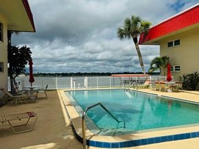 Daytona Beach house for rent - the swimming pool at a hotel with a lake in the background