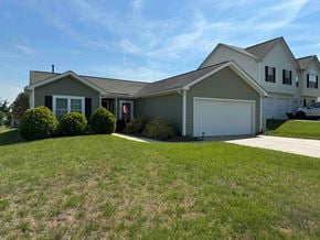 Charlotte house for rent - a house with a lawn in front of it