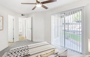 Glendale apartment for rent - A bedroom with a bed and a ceiling fan.