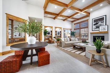 Loveland apartment for rent - A living room with a large table and a couch.
