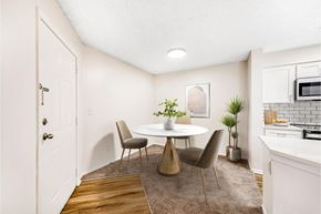 Westminster apartment for rent - A dining room with a white table and chairs.