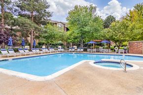 Westminster apartment for rent - A pool surrounded by trees and chairs.