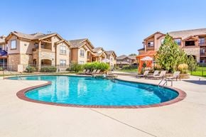 Westminster apartment for rent - A large swimming pool in front of a row of houses.