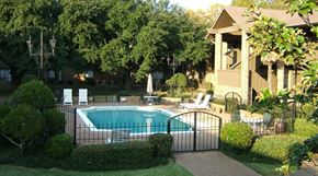 Jackson apartment for rent - a pool in front of a house with a black fence