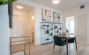 Calgary apartment for rent - A modern dining room with a round table and chairs.