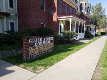 Williamsport apartment for rent - a sign in front of a brick building