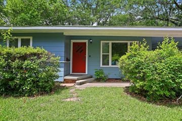 Jackson house for rent - the front of a blue house with a red door