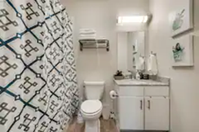 Richardson house for rent - a bathroom with a toilet and a sink and a shower