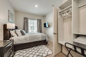 Richardson house for rent - a bedroom with a bed and a closet