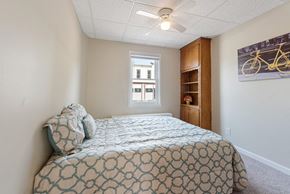 Mayer apartment for rent - a bedroom with a bed and a ceiling fan