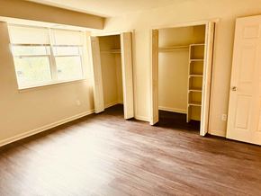 Washington apartment for rent - A room with a window, a door, and a closet.