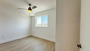 Los Angeles apartment for rent - A room with a ceiling fan and a window.