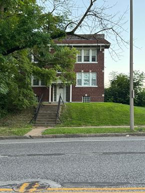 Saint Louis apartment for rent - a red brick house with stairs in front of it