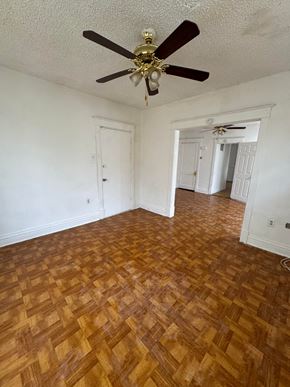 Saint Louis apartment for rent - an empty living room with wood flooring and a ceiling fan