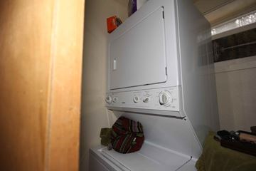 Whitefish apartment for rent - A white oven with a red button on top is in a kitchen.