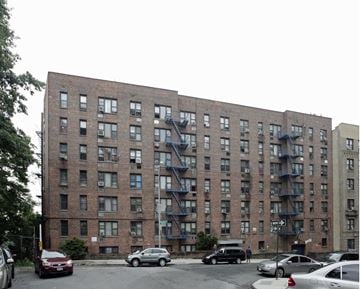 Yonkers apartment for rent - a building with a fire escape on the side of a street
