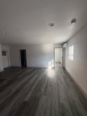 Imperial Beach apartment for rent - A room with wooden flooring and white walls.