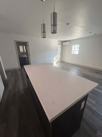 Imperial Beach apartment for rent - A kitchen with a white counter top and dark wood flooring.