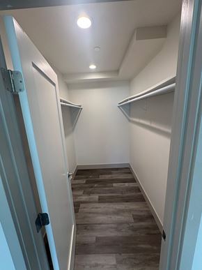 Imperial Beach apartment for rent - A hallway with a light on the ceiling and a door on the left.