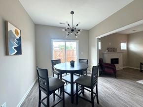 Fayetteville house for rent - A dining room with a table and chairs.
