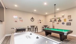 Fayetteville house for rent - A room with a pool table and air hockey table.