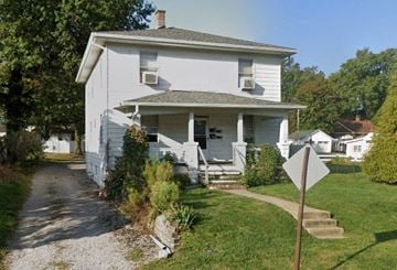 Belleville apartment for rent - a white house with a street sign in front of it