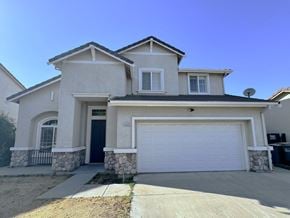 Merced house for rent - a white house with a white garage door