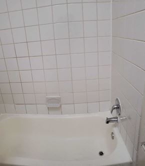 Washington apartment for rent - a white tiled bathroom with a tub and a sink
