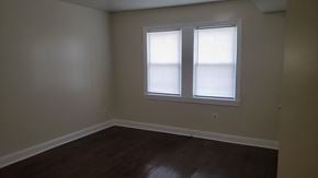 Washington apartment for rent - an empty room with a window and wooden floors