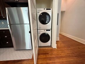 Little Rock apartment for rent - a washing machine and a refrigerator in a doorway