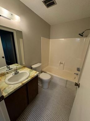 Little Canada house for rent - a bathroom with a toilet and a sink and a shower