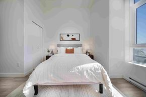 Coquitlam apartment for rent - A bedroom with a large bed and a window.