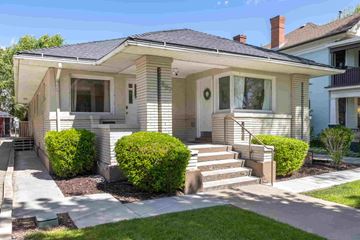 Salt Lake City apartment for rent - a small white house with steps and a sidewalk