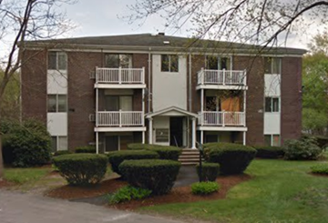 Holbrook apartment for rent - an apartment building with bushes in front of it